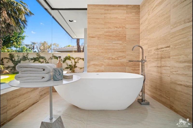 Freestanding tub in travertine bath