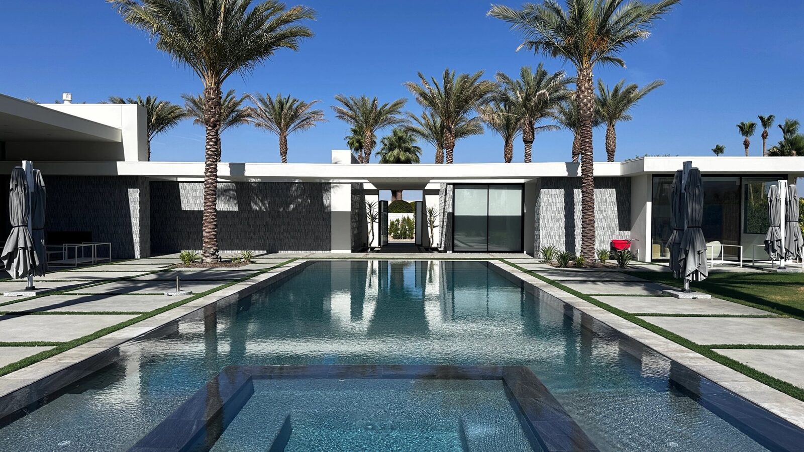 Zero-edge pool and modern estate at night, Rancho Mirage