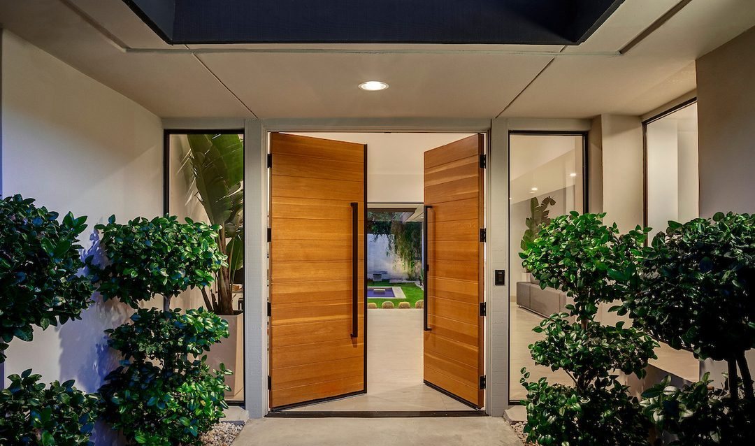 Pivoting oak entry doors, Rancho Mirage lakefront remodel