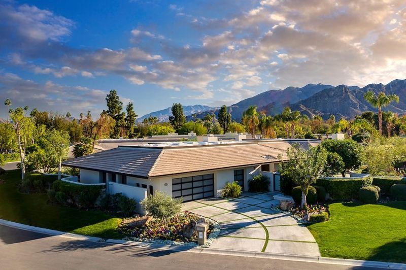 Aerial of the home with mountain views