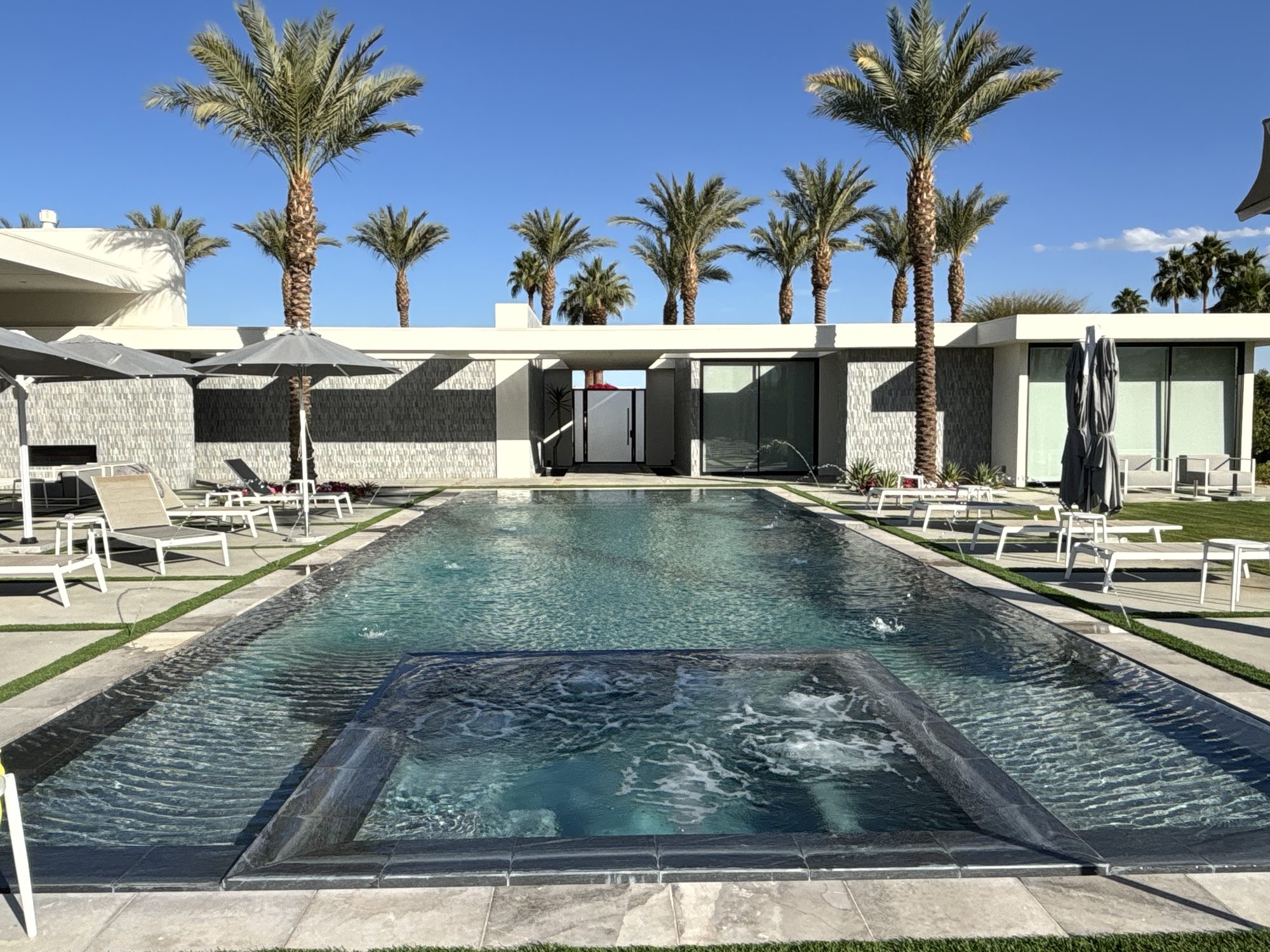 Pool and modern desert home with palms, Rancho Mirage, built by Blackoak Construction