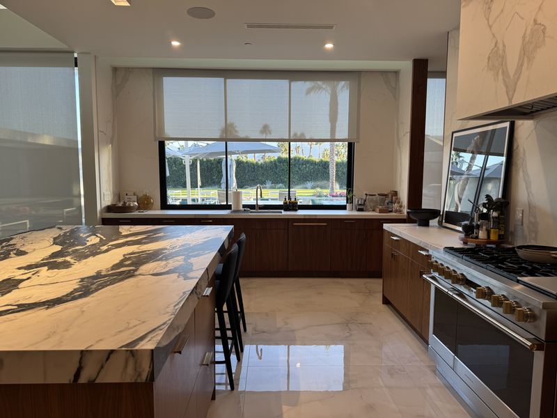 Kitchen with marble island and walnut cabinetry, Rancho Mirage custom home