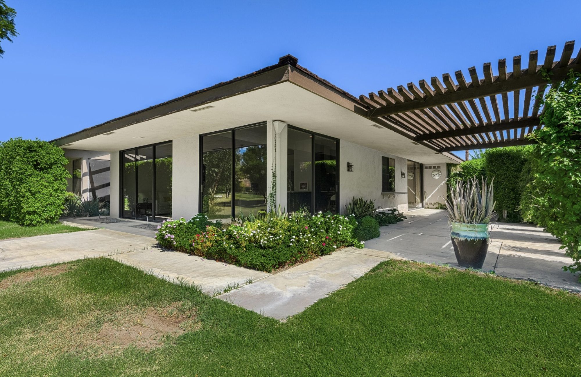 Mid-century home with pergola and lawn, Rancho Mirage remodel